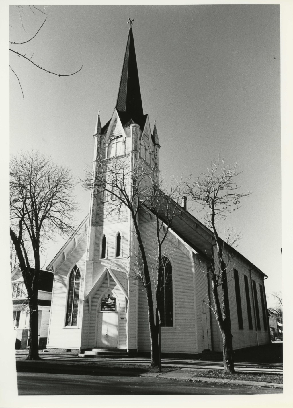 GETHSEMANE EVANGELICAL LUTHERAN CHURCH
4461 Twenty-eighth Street
Detroit, Wayne County, Michigan
PHOTOGRAPHER: Unknown
DATE: December, 1980
NEGATIVE: M.A.C.O.
6608 Michigan Avenue
Detroit, MI 48210
VIEW: Looking west at the twenty-eighth
Street elevation
PHOTO #: 1 of 5